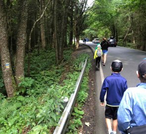 A short distance from the parking lot, we're walking down the road