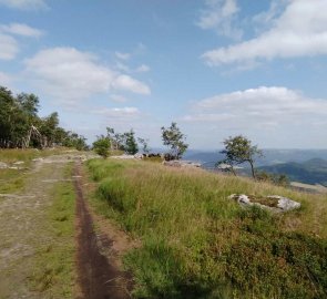 A wide path along the edge of the rocks