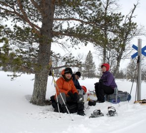 Resting on the road by the cross-country marker