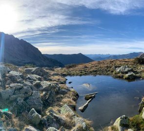 Small lake in the saddle under the mountain