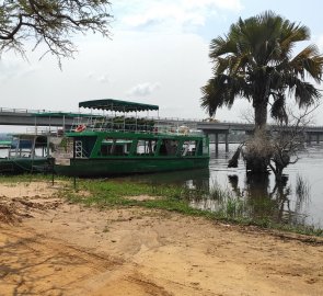 Partially flooded site of the former ferry and the new bridge in the background