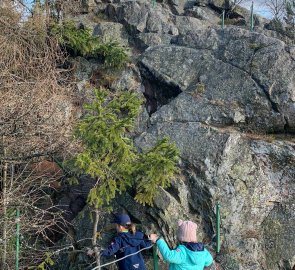 The path along the rock is secured by railings