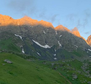 The first rays of the sun on the mountain peaks